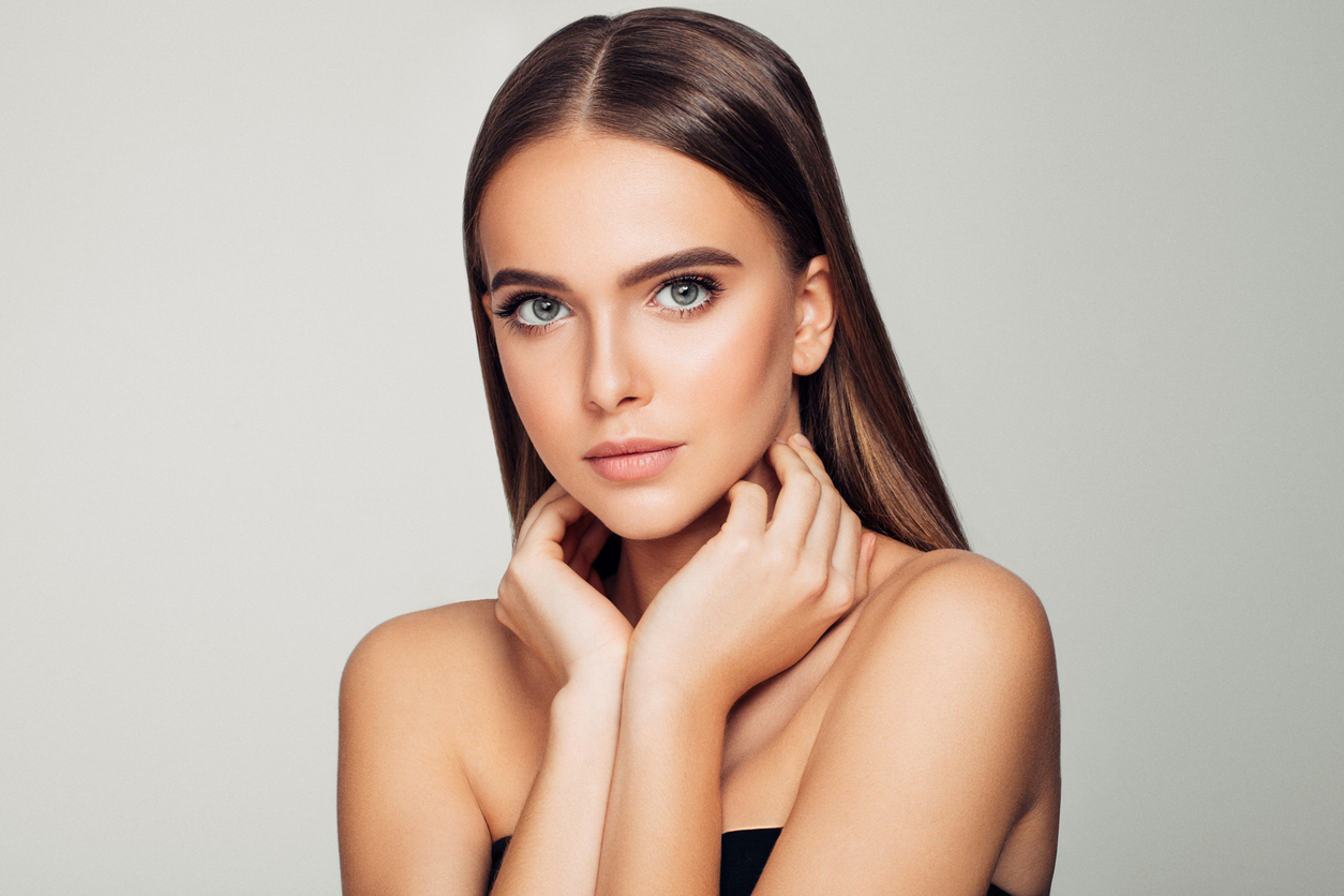 Woman touching neck